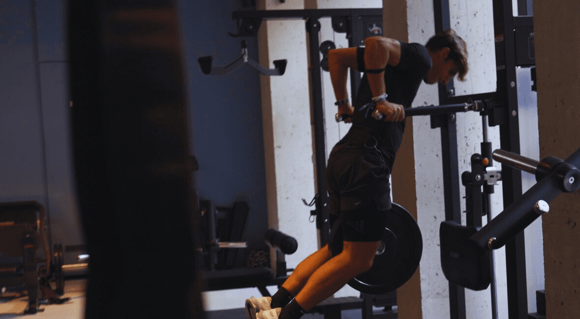 Weighted dips in the gym